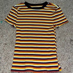 This is a size small (3-5) it’s a yellow, red, orange, and black shirt.